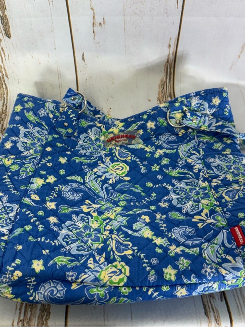 UNIONBAY Blue Quilted Floral Shoulder Bag with Green and Yellow Accents.